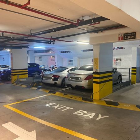 Hidden WÖHR car lift providing space-saving parking in a Cape Town residential development.